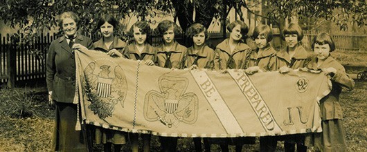 Historical picture of Juliette Gordon Low and some of the original Girl Scouts